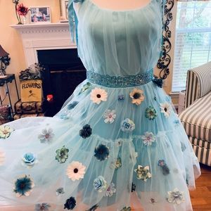 “Whimsical You”! Blue multi floral tulle cocktail with shoulder ties. Unique!